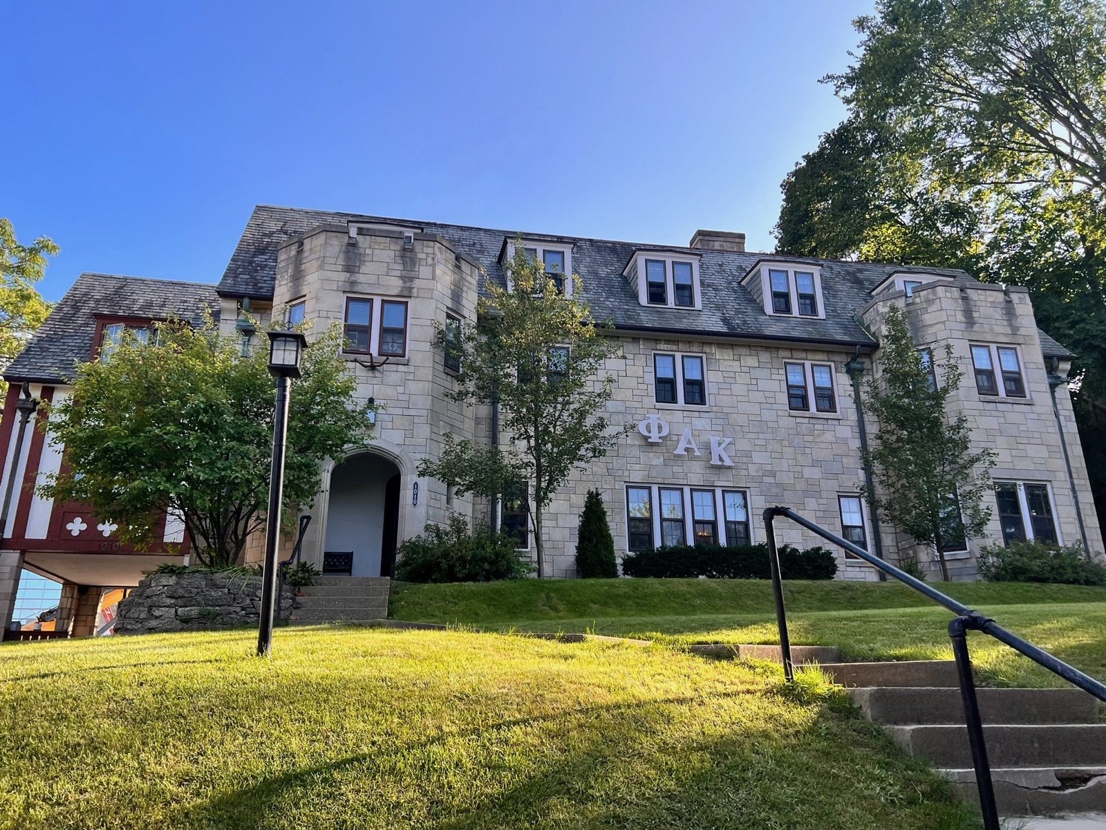 The stone exterior of the Phi Alpha Kappa Dutch House at 1010 E Ann Street